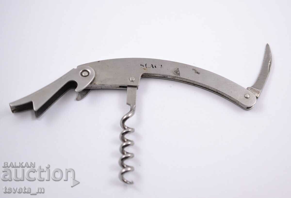 Auction  Corkscrew and blade opener