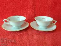 Two double old porcelain sets of cups and saucers marked Moka