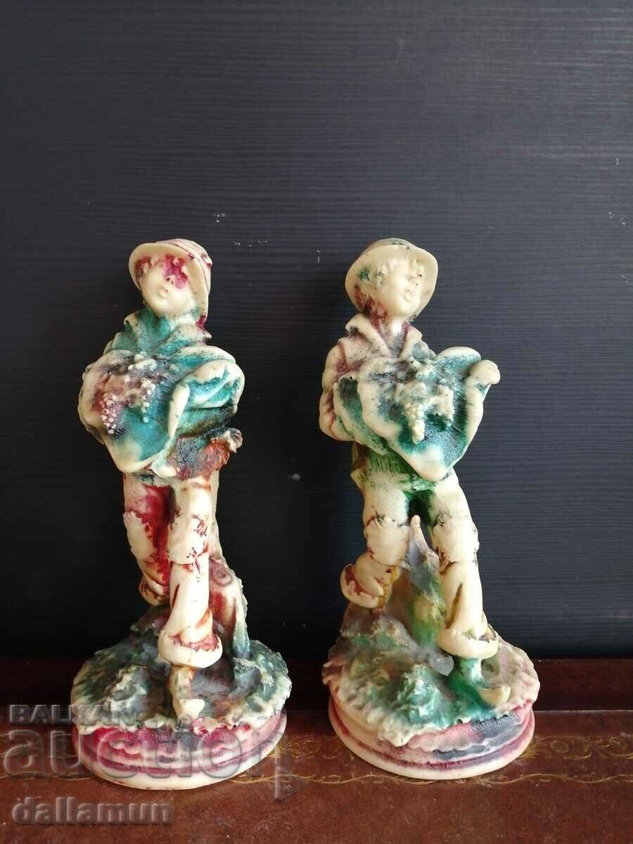 a pair of vintage vinyl figurines
