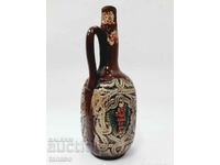 Ornate ceramic pitcher (4.5)