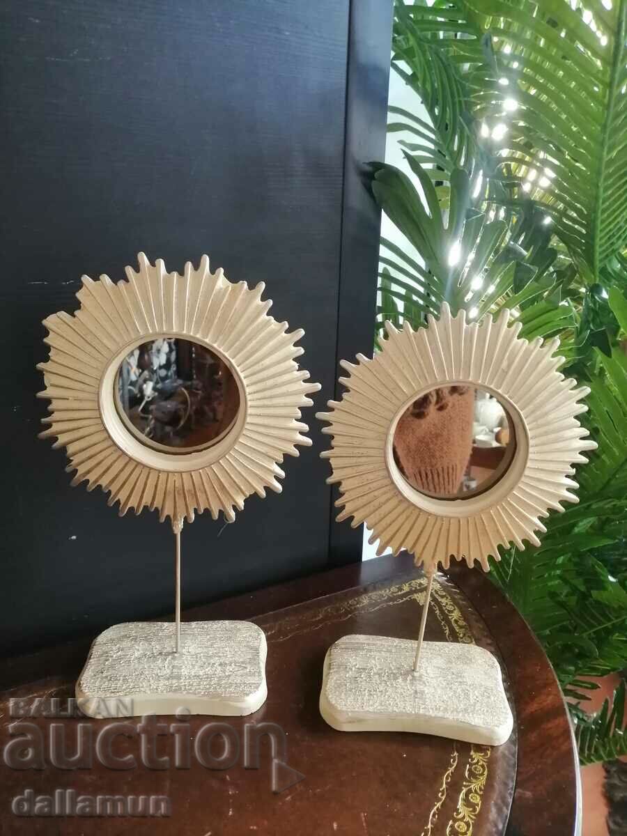 a pair of fancy mirrors for decor