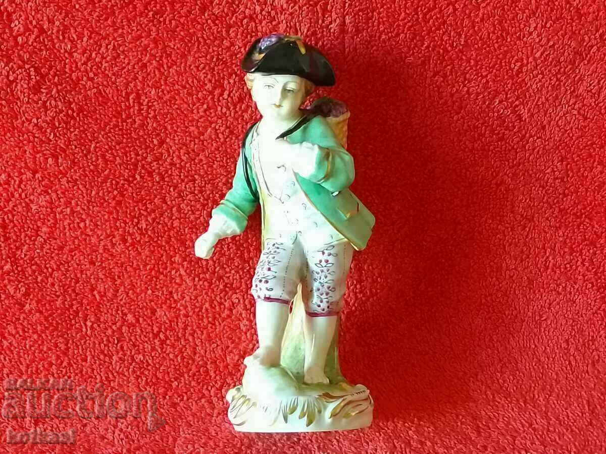 Old porcelain figurine Boy Grape Picker Dresden Germany Old porcelain figurine Boy Grape Picker Dresden Germany