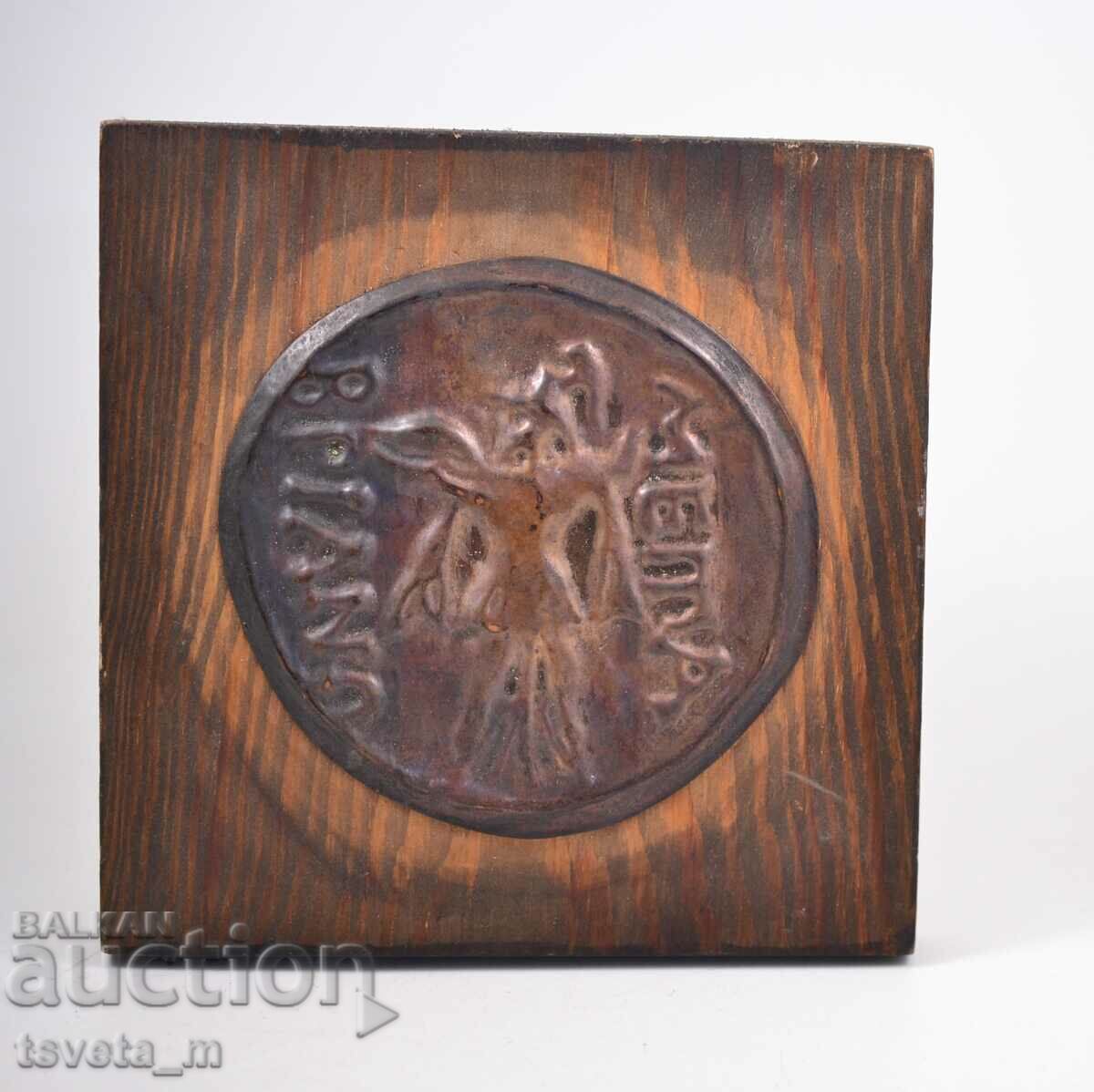 Decorative wooden panel, antique coin, copper