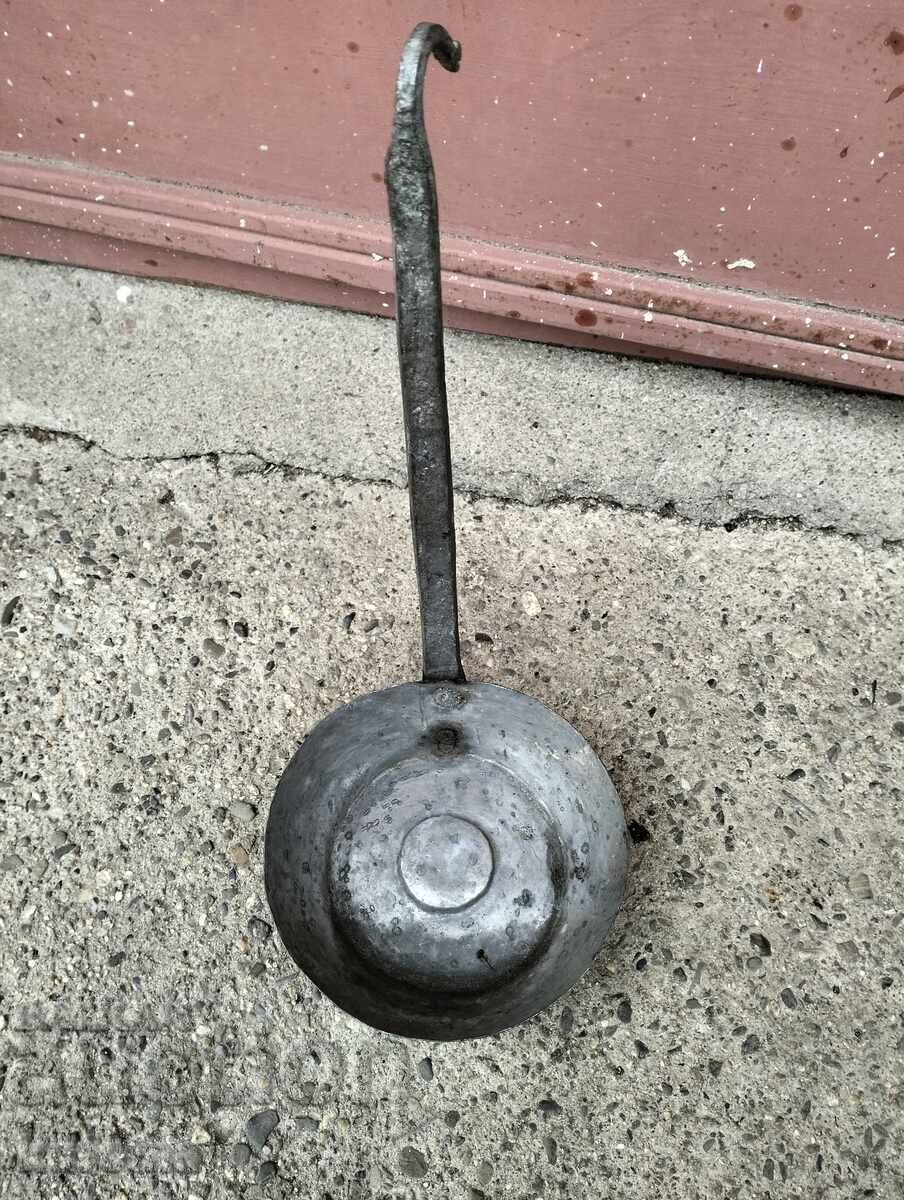 Old copper ladle