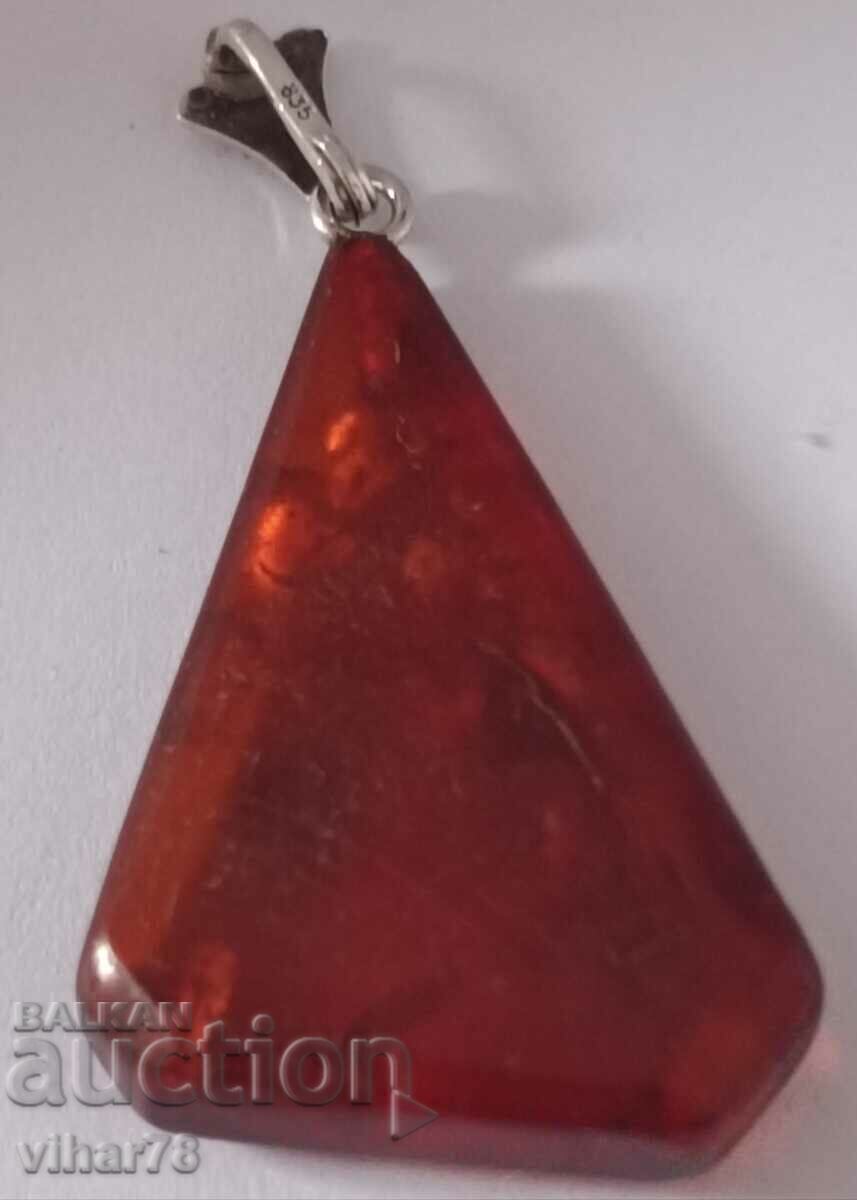 Silver pendant with amber