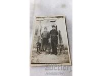 Photo Two hunters with two hunting dogs and a trophy fox