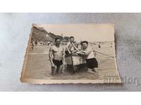 Photo Burgas Two men and a boy on a boat for walks