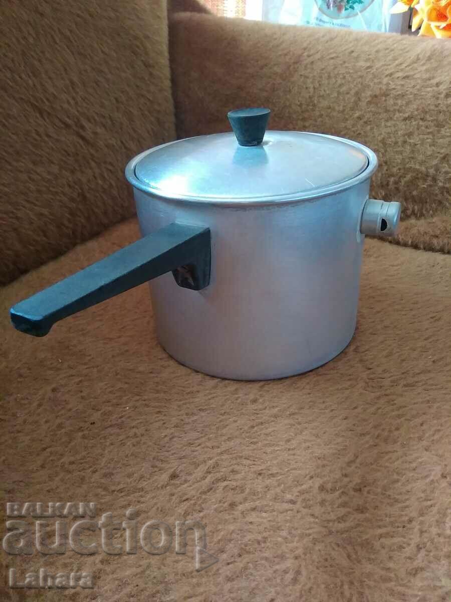 A vessel, a pot for boiling milk