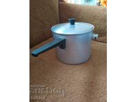 A vessel, a pot for boiling milk
