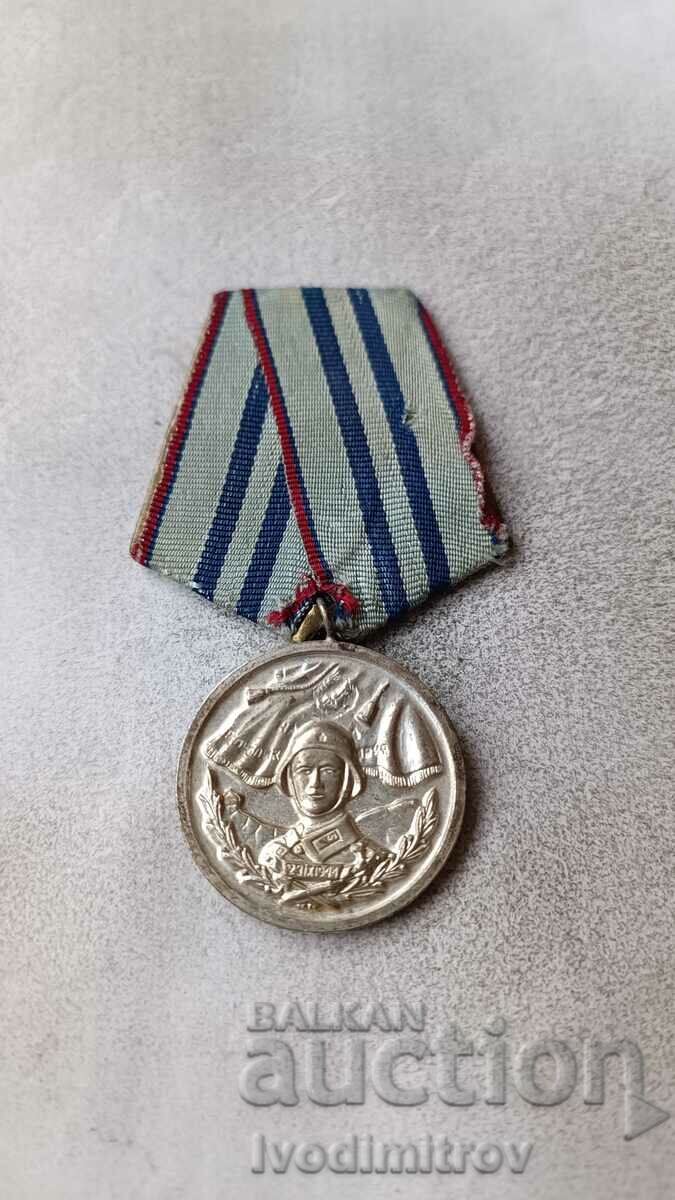 Μετάλλιο Για 15 χρόνια άψογης υπηρεσίας στις ένοπλες δυνάμεις της NRB