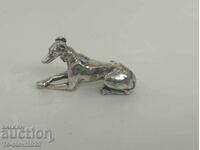 Old silver dog figure