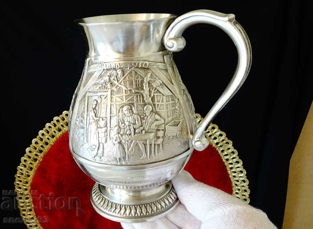 Auction  Tin mug with three romantic relief paintings.