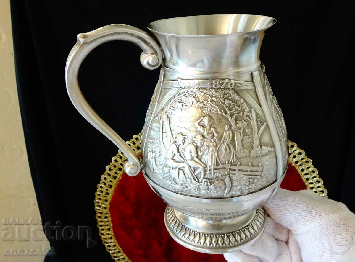 Tin mug with three romantic relief paintings.