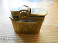 old bronze gas lighter