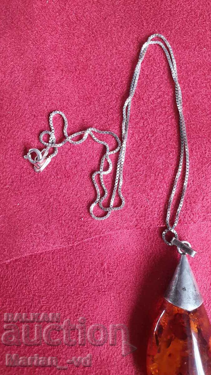 Amber pendant with silver fittings and silver chain with price 100.00 BGN | € 51.13 Amber pendant with silver fittings and silver chain with price 100.00 BGN | € 51.13