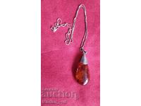 Amber pendant with silver fittings and silver chain