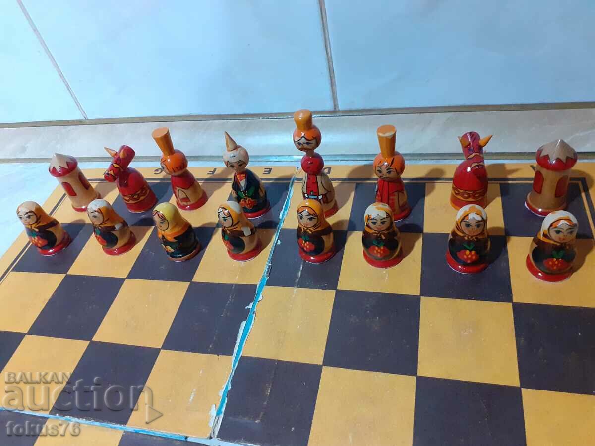 Delivery of Russian wooden chess with handmade matryoshka pieces Delivery of Russian wooden chess with handmade matryoshka pieces