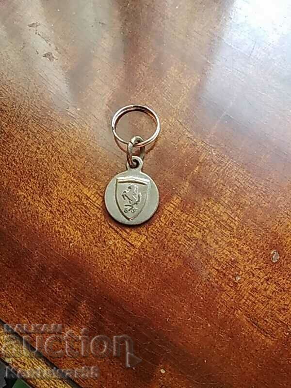 A small metal key ring. A small metal key ring.