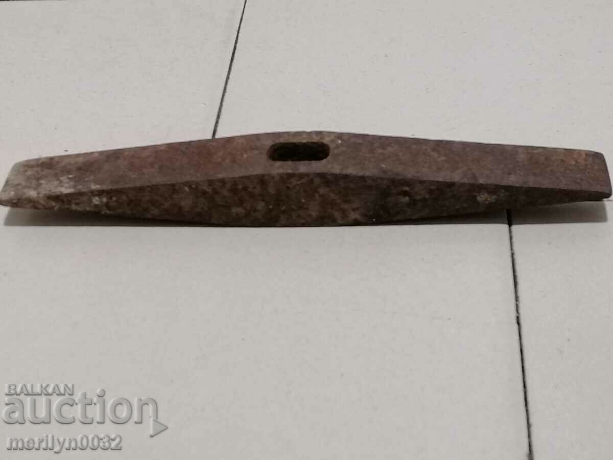 Old mason's hammer, tool, pickaxe Old mason's hammer, tool, pickaxe