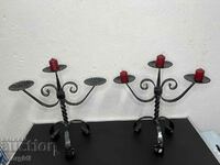 A pair of wrought iron candlesticks. #5087