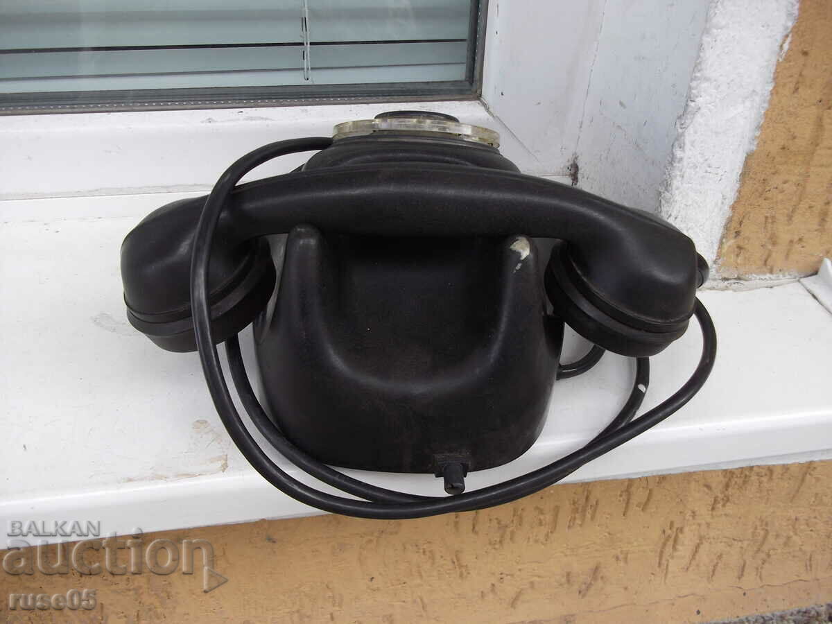 Delivery of Telephone puck black bakelite old from early social