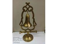 BRONZE BELL ON A STAND WITH ORNAMENTS