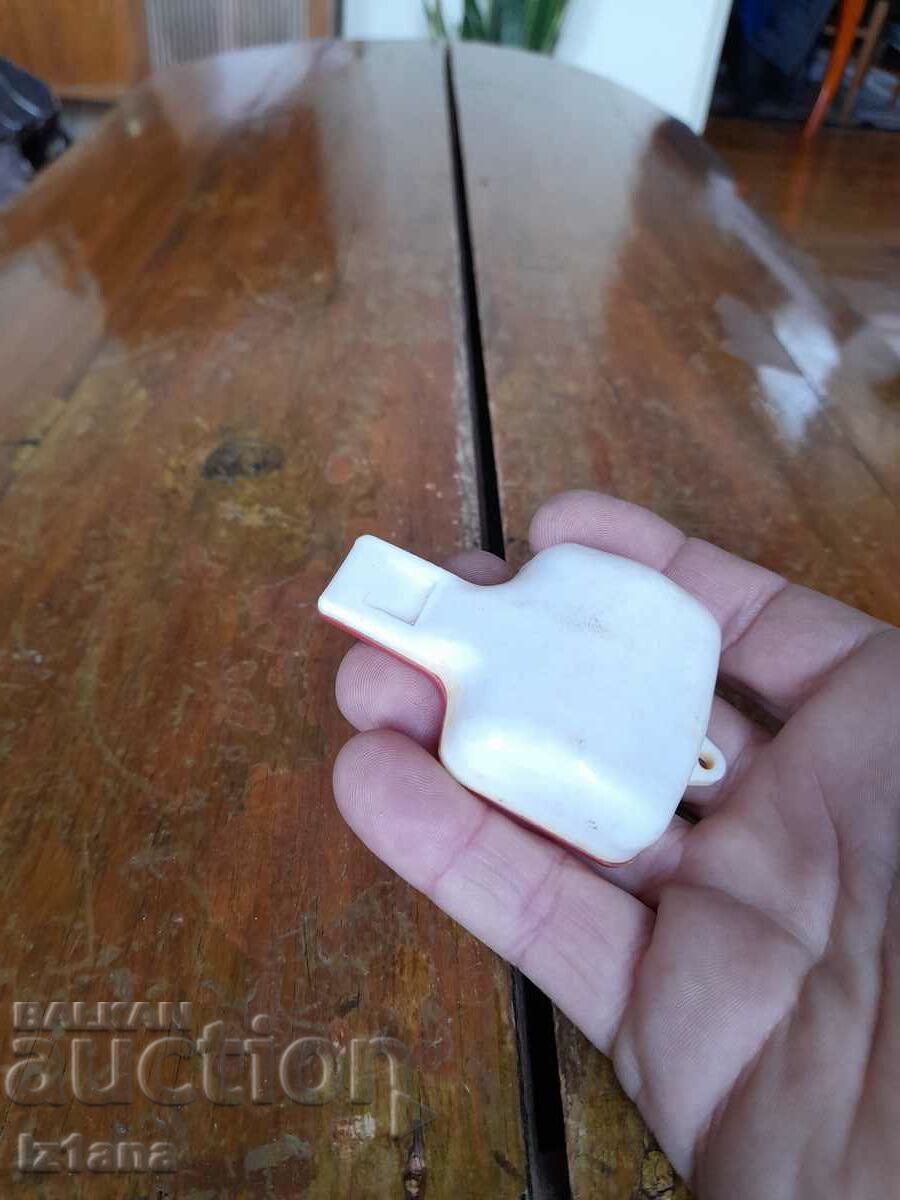 Delivery of An old children's whistle Delivery of An old children's whistle