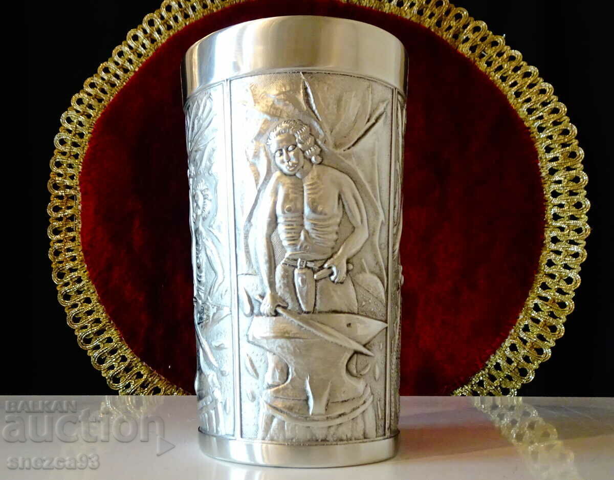 A mug, a pewter cup with a heroic blacksmith and a dragon. with price 76.00 BGN | € 38.86 A mug, a pewter cup with a heroic blacksmith and a dragon. with price 76.00 BGN | € 38.86