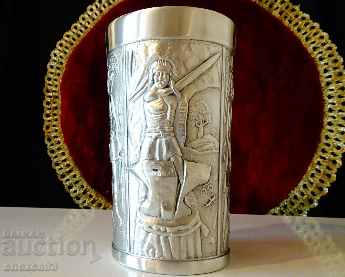 Delivery of A mug, a pewter cup with a heroic blacksmith and a dragon. Delivery of A mug, a pewter cup with a heroic blacksmith and a dragon.