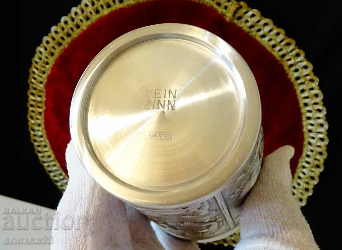 A mug, a pewter cup with a heroic blacksmith and a dragon. - 6 A mug, a pewter cup with a heroic blacksmith and a dragon. - 6