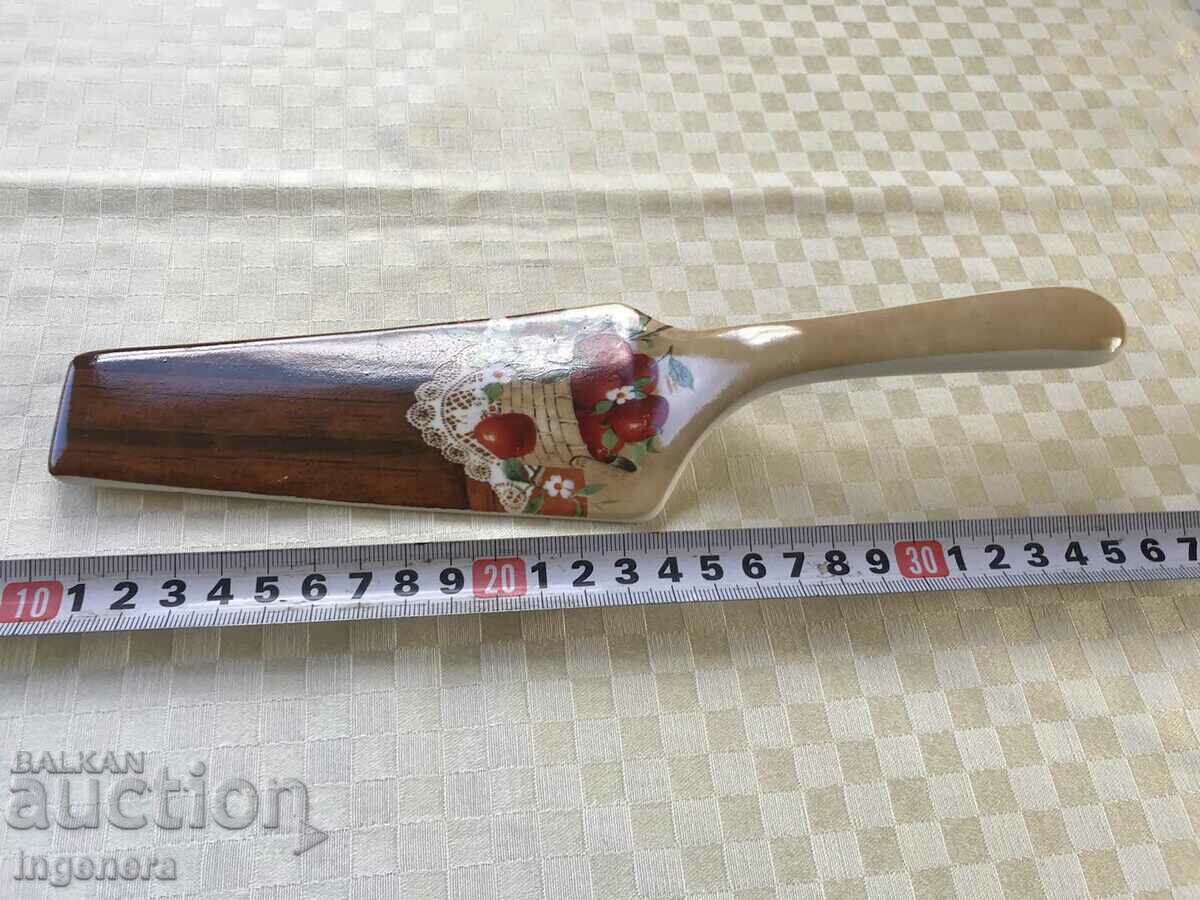 Auction PORCELAIN SPATULA Auction PORCELAIN SPATULA