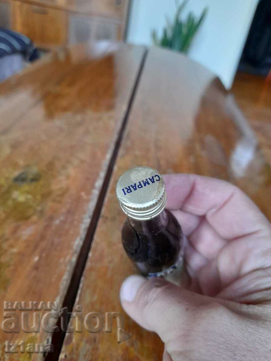 Delivery of An old bottle of Campari