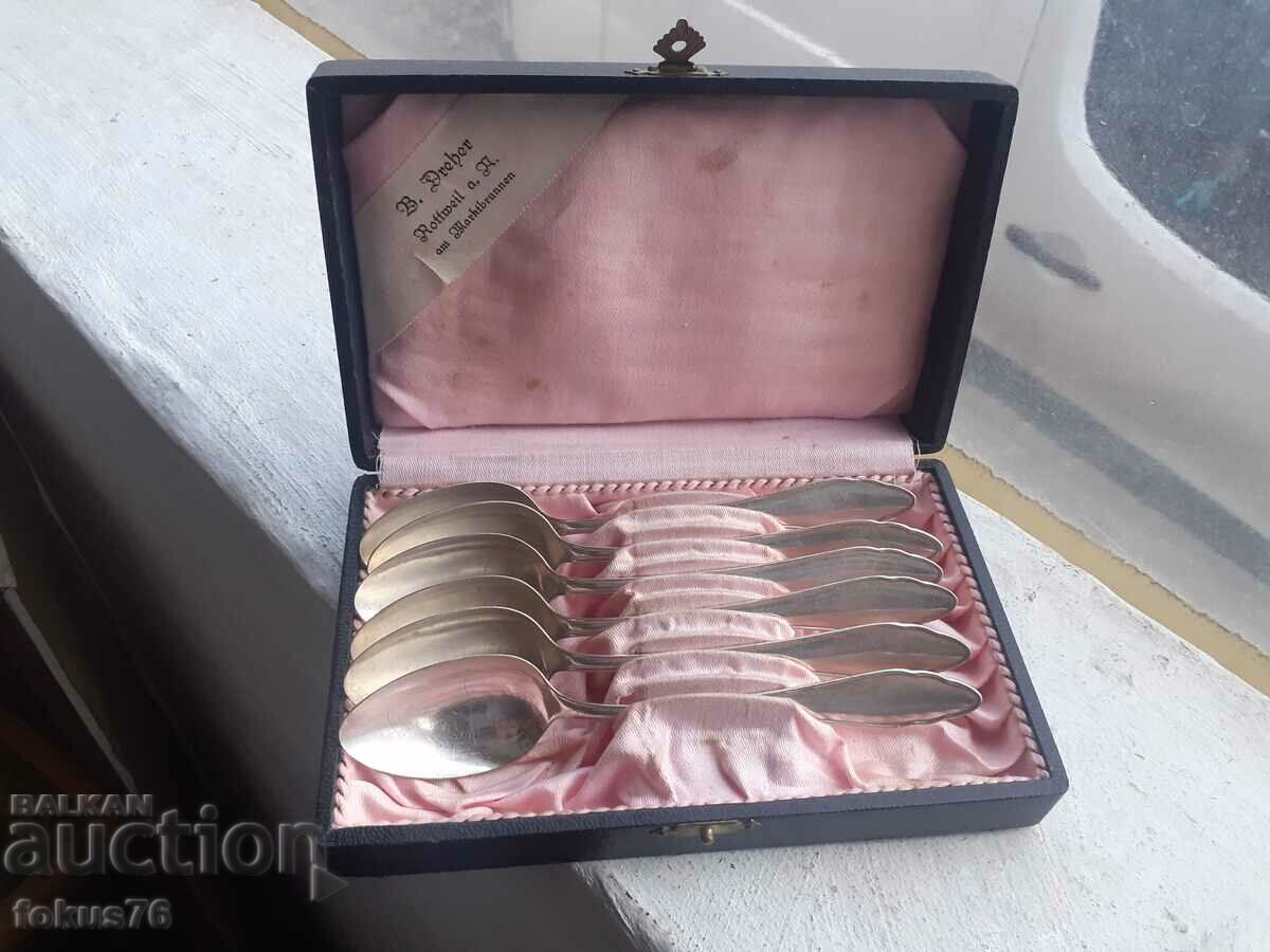 Set of silver plated collectible spoons in a box