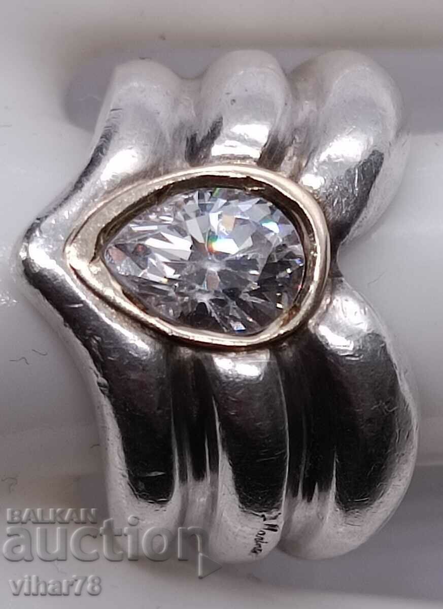 A silver ring with a gold bracelet around the stone with price 184.99 BGN | € 94.58 A silver ring with a gold bracelet around the stone with price 184.99 BGN | € 94.58