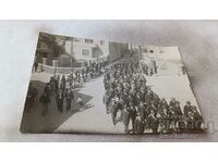 Photo Procession of men on the street