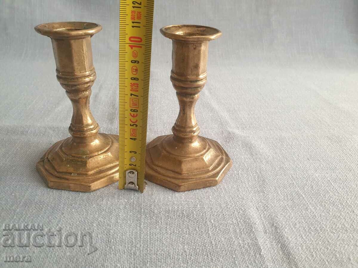Auction A pair of bronze candlesticks Auction A pair of bronze candlesticks
