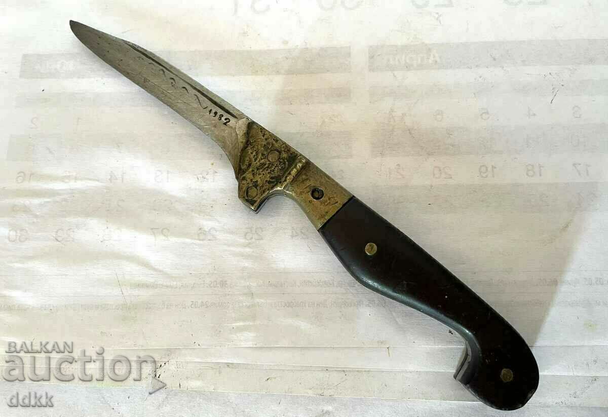 A beautiful old knife with brass and markings