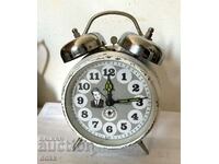 A beautiful white old clock with bells