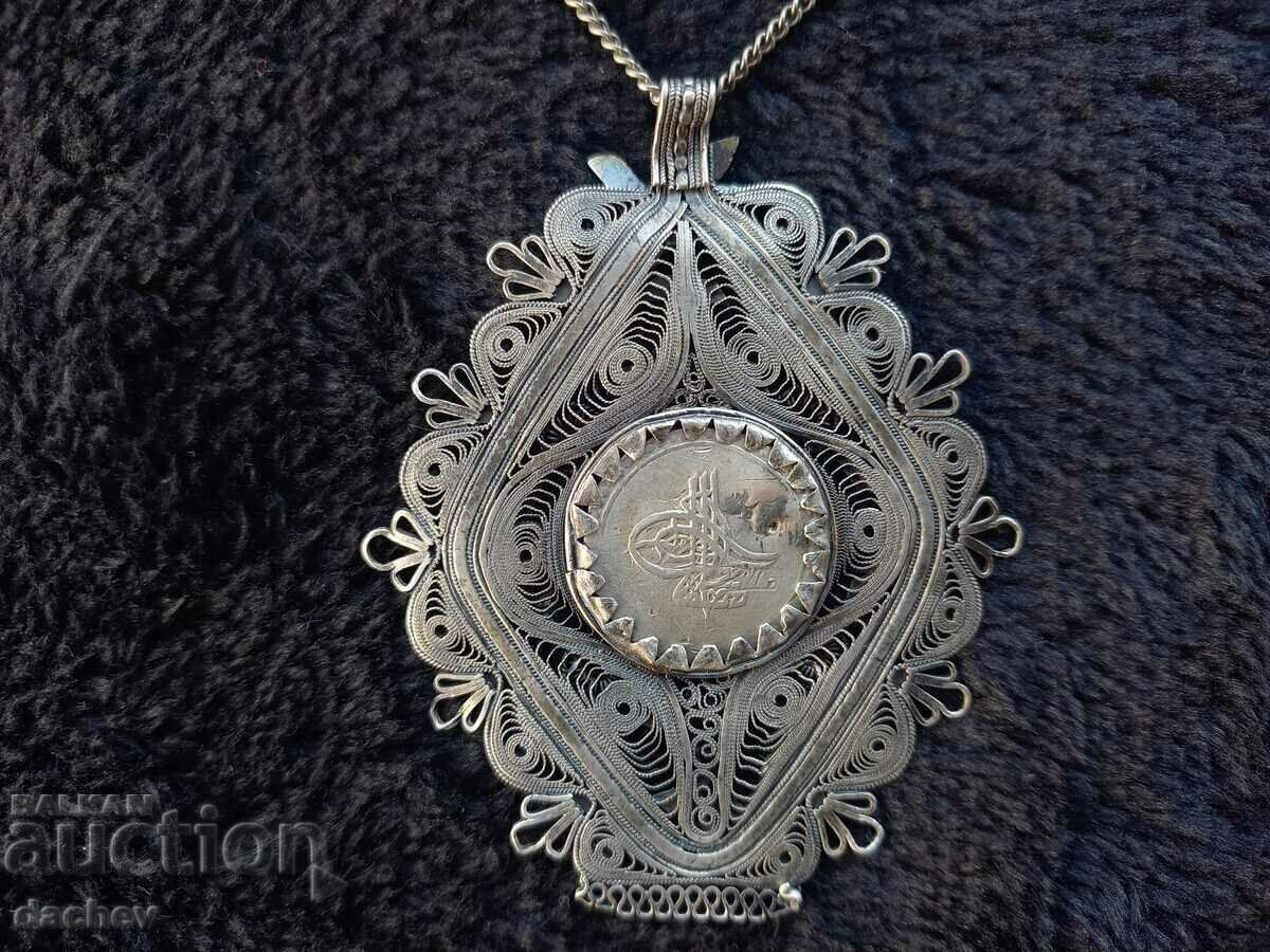 Delivery of Renaissance silver filigree medallion with bird ornament costume