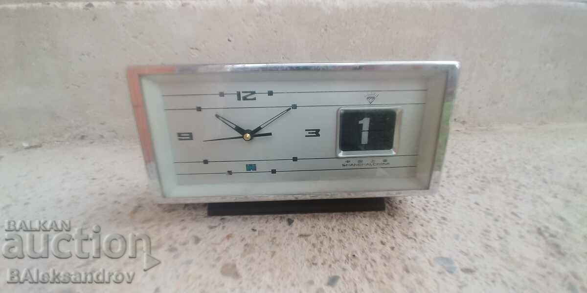 Old alarm clock with date