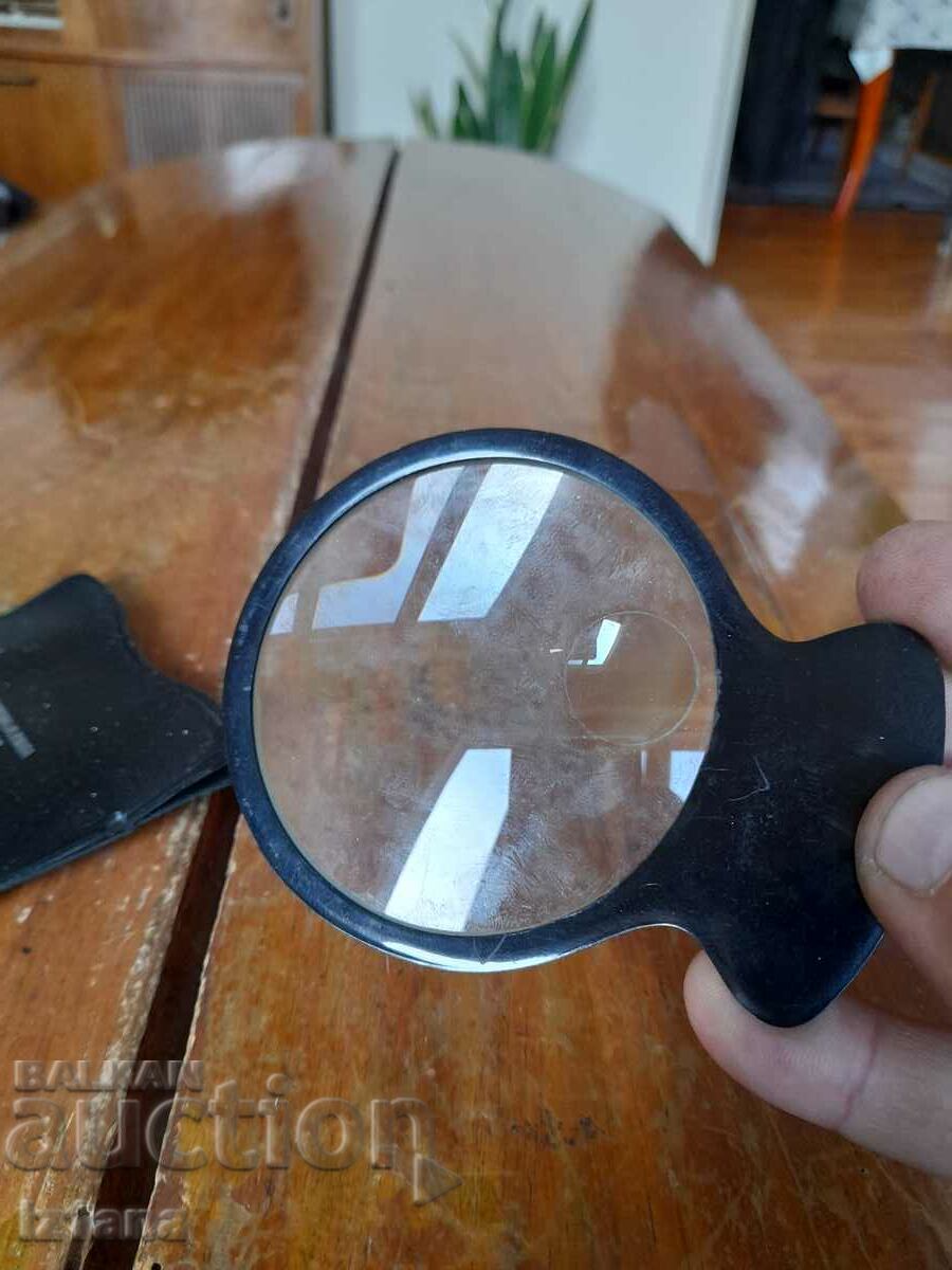 Delivery of Old magnifying glass Delivery of Old magnifying glass