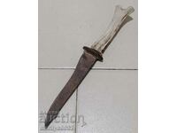 Old knife with antler hilt and blade