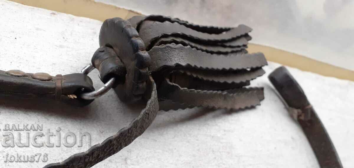 Auction  Old leather whip, tassel, horse ornament