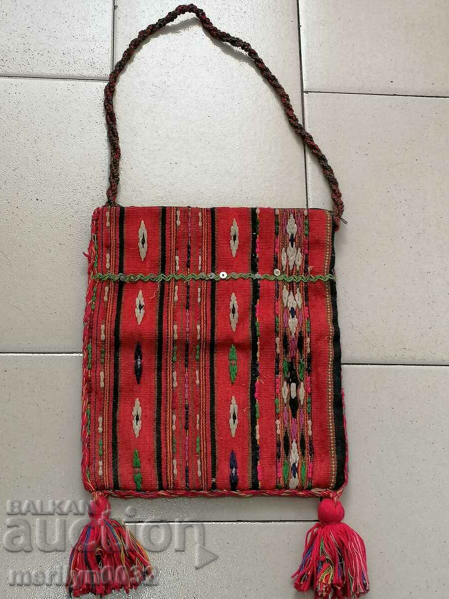 Old handwoven carol bag with tinsel