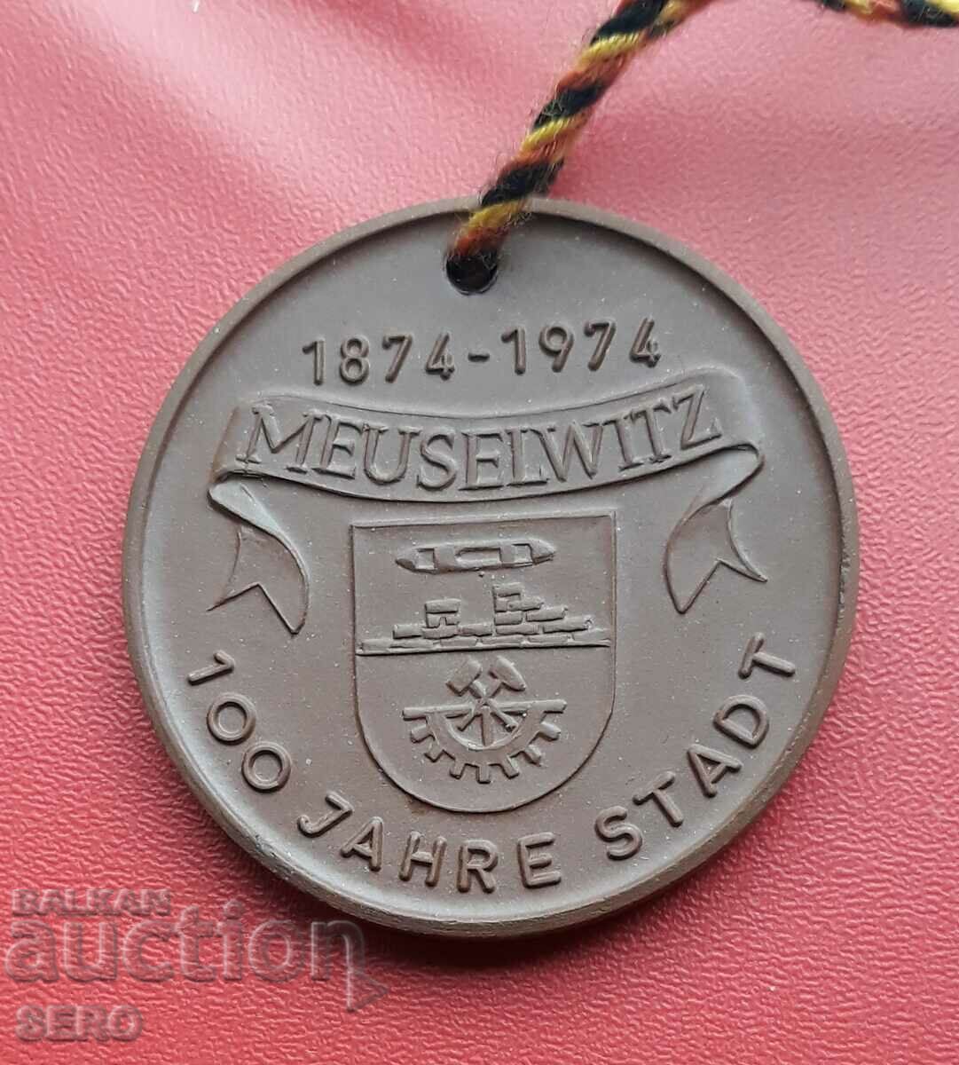 Германия-ГДР-медал от порцелан 1974-100 г. град Меузелвиц