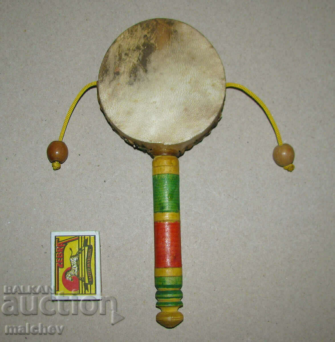 Buddhist prayer hand drum with handle and 2 balls ext.