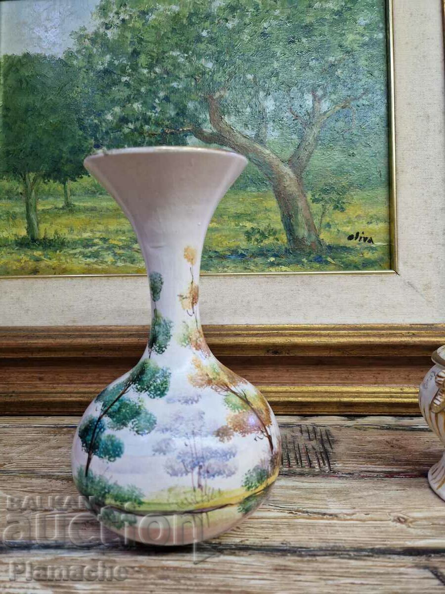 A vase with a forest landscape