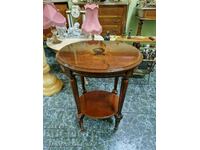 A lovely antique English solid wood table with marquetry