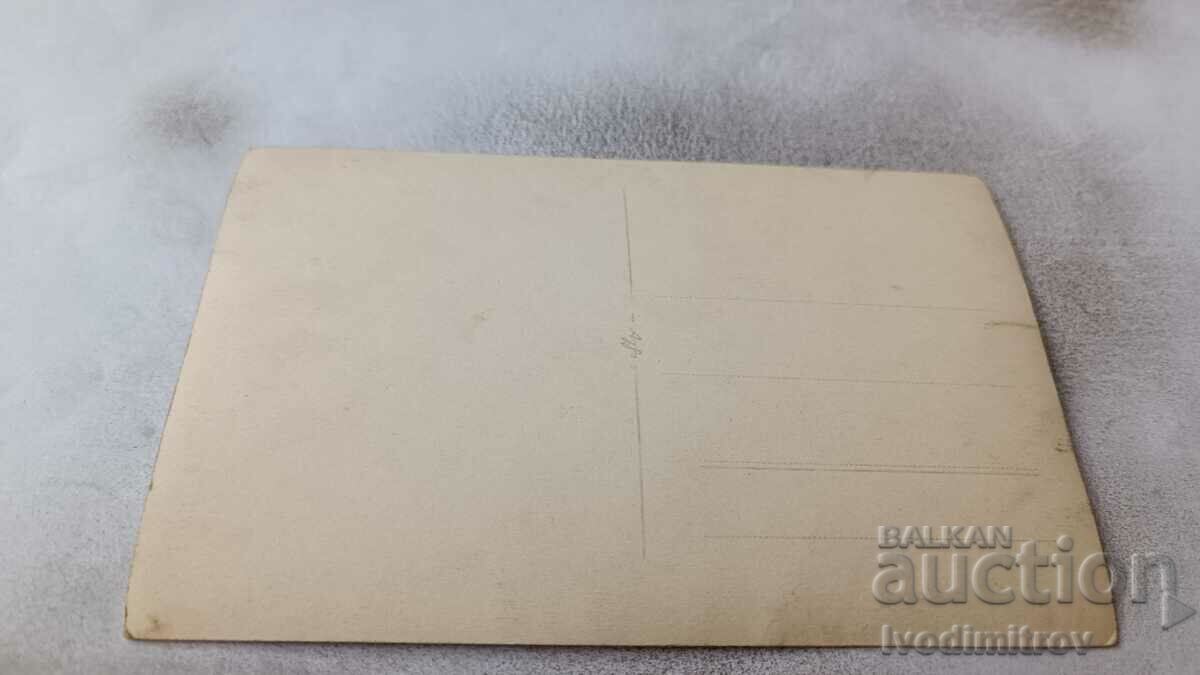 Photo Man, woman and baby in front of a newly built house with price 3.45 BGN | € 1.76 Photo Man, woman and baby in front of a newly built house with price 3.45 BGN | € 1.76