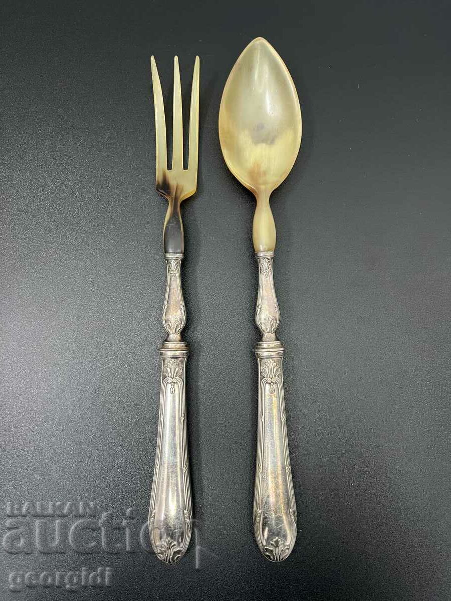 A pair of old silver plated cutlery with horn tips. #5234
